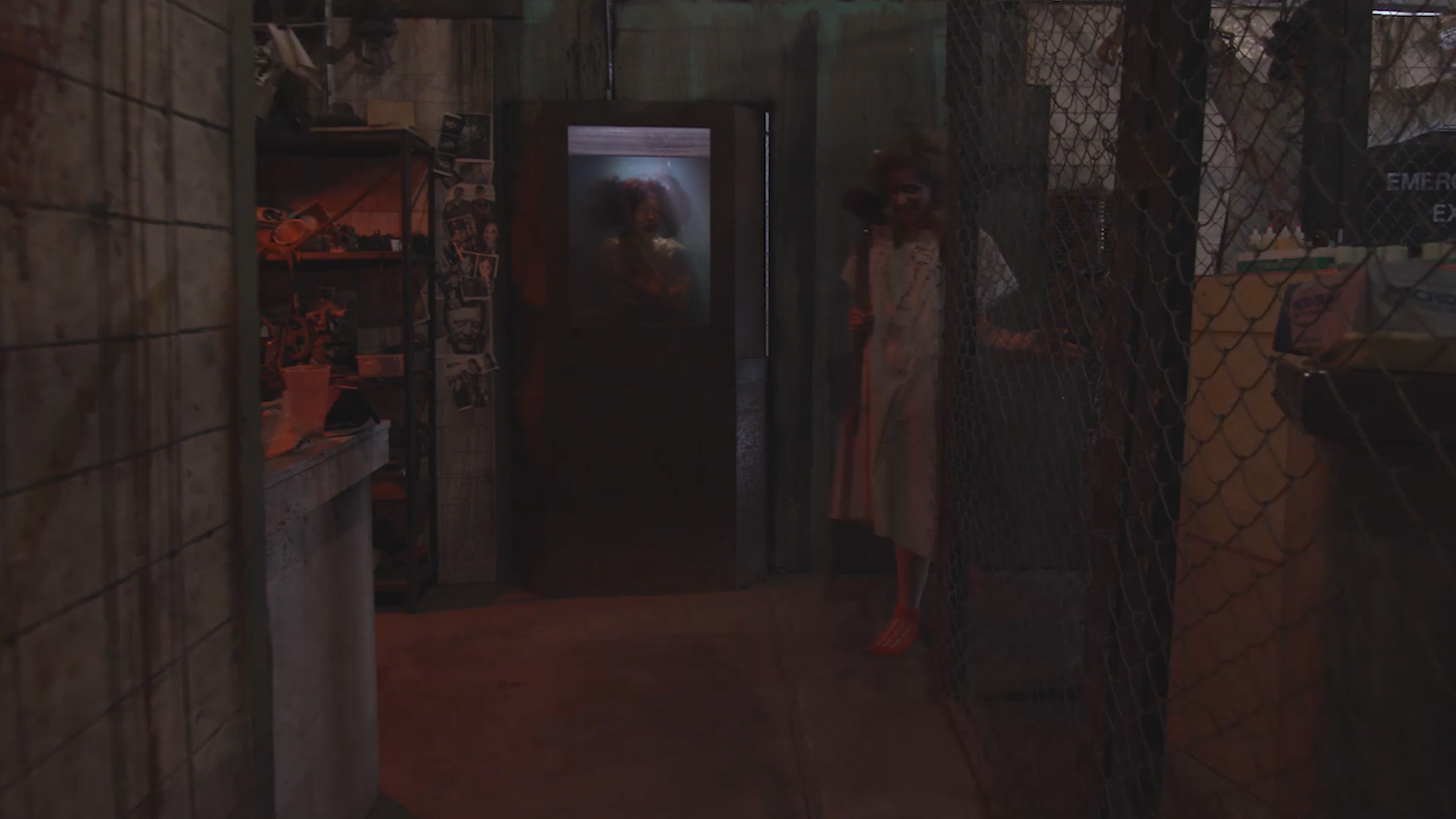 Zombie-looking woman in a haunted house setting, holding a sledge hammer